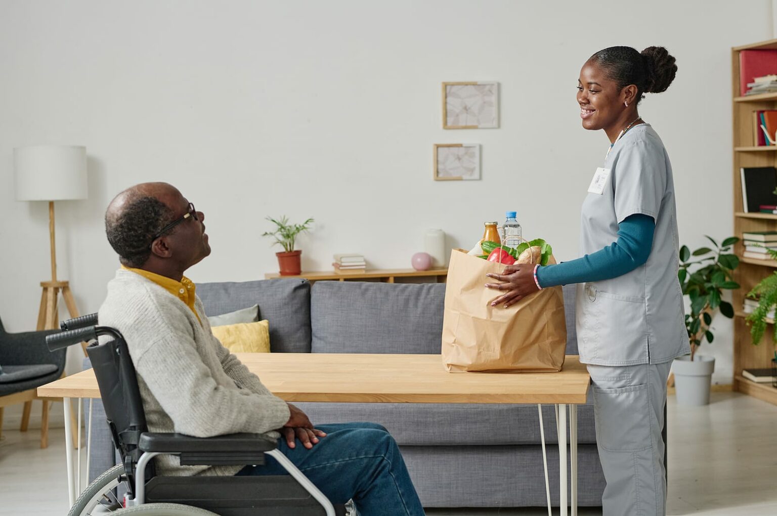 Take A Closer Look At The Benefits Of Home Care Assistance   Bigstock African Young Volunteer Bringi 458793249 1 1536x1020 